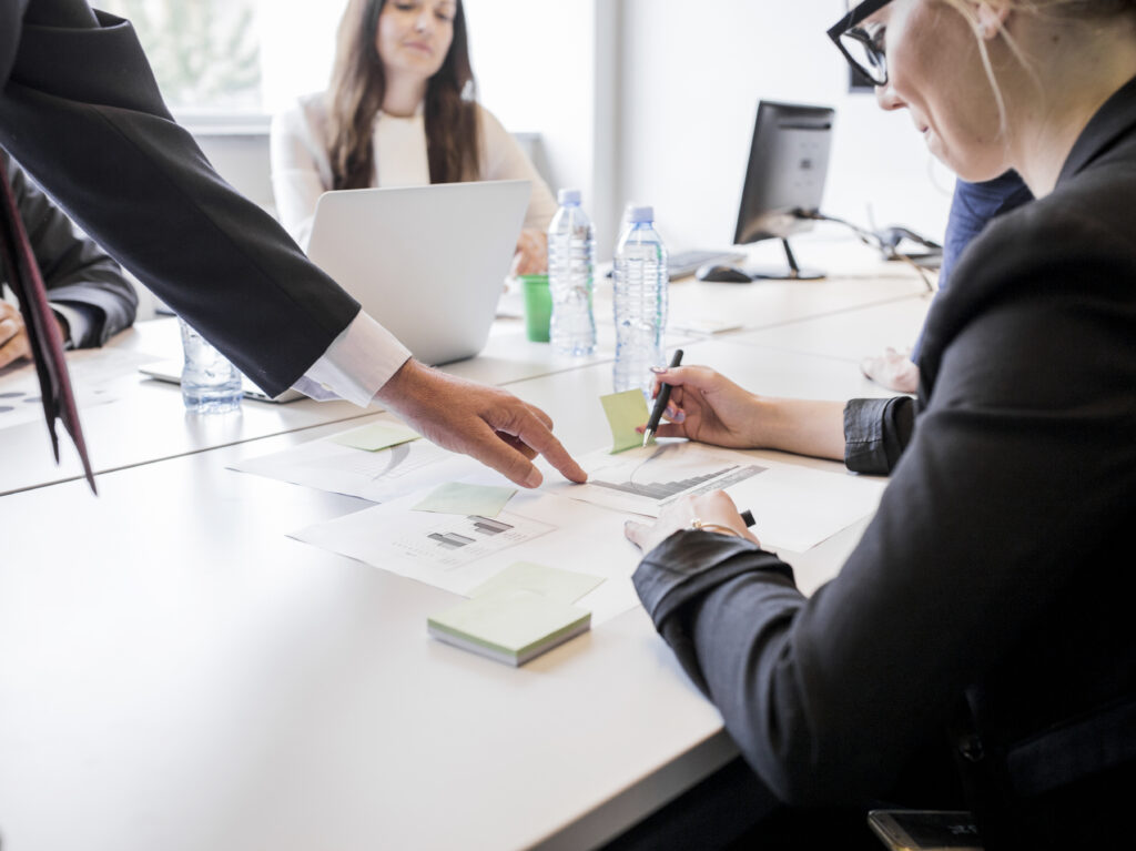 businesspeople-working-with-paper-graph-chart-analysis-business-marketing-plan